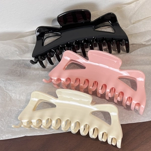 Elegant hollow butterfly hair claw clips set in black, pink, and cream for thick hair
