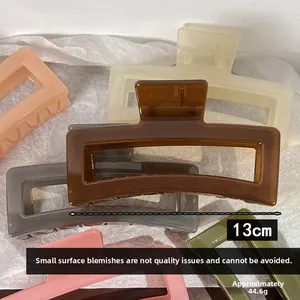 Close-up of 13cm jelly-colored large rectangular hair claws in various earthy tones
