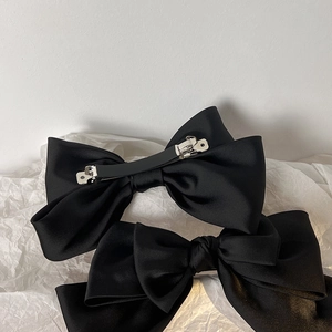 Elegant black satin bow hair clips for women with metal spring back in Hepburn style