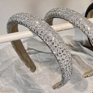Close-up of sparkling full rhinestone padded headband with premium silver crystal detailing