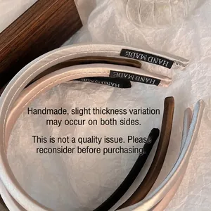 Elegant satin headbands in champagne, brown and black colors with handmade fabric labels