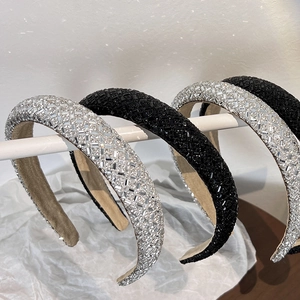 Detailed close-up of padded headbands featuring sparkling rhinestones and black sequins