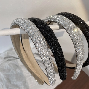 Detail of padded sponge headbands with sparkling rhinestones in silver and black colors