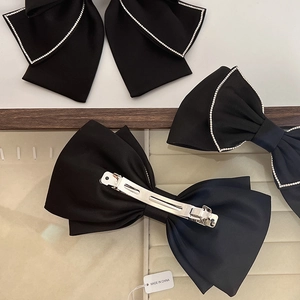 Elegant black satin bow hair clips with rhinestone edges and silver spring clips
