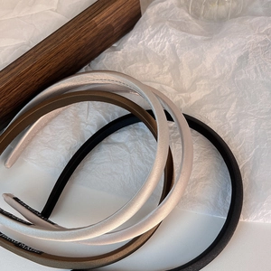 Three-piece narrow satin headbands in champagne gold, brown and black with silk luster