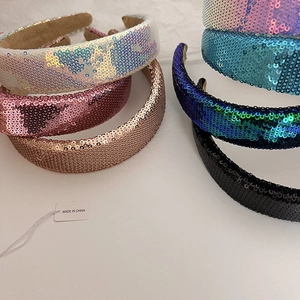 Detailed macro view of sparkling sequins headband with non-slip velvet inner lining