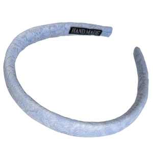 Elegant light blue lace headband with handmade label and retro textured fabric finish