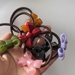 Set of 6 colorful acrylic bow hair ties with France Handmade gold lettering detail