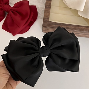 Elegant large multi-layer black satin bow hair clip for women with premium fabric texture