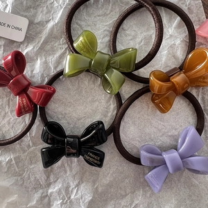 Five colored acrylic bow hair ties with France Handmade print on high elastic bands
