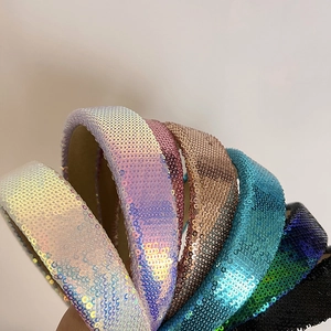 Close-up of wide sequined headbands in multiple colors with non-slip velvet lining