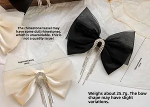 Detail view of mesh bow hair clip with rhinestone tassels measuring 16cm by 12cm