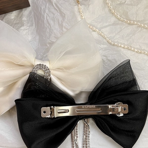 Vintage mesh bow hair clip with sparkling rhinestones and elegant tassels in black and cream