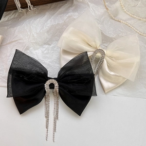 Elegant vintage mesh bow hair clip with sparkling rhinestone fringe in black and cream