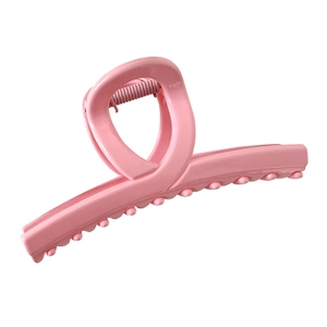 Minimalist pink claw clip for women featuring a matte resin finish and modern shark grip design