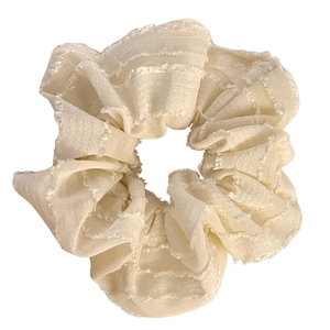 Elegant cream fabric oversized hair scrunchie with plaid texture and frayed edges