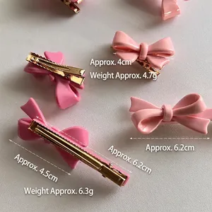 Barrettes à cheveux nœud rose en deux tailles avec clip en métal doré brillant