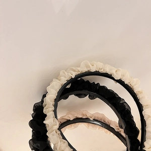 Detailed view of layered pleated chiffon headbands with anti-slip inner teeth base