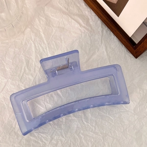 Detail of a 13cm lavender translucent hair claw clip with a square hollow design