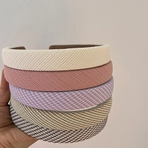 Set of five padded plaid and solid fabric headbands in assorted pastel colors for women