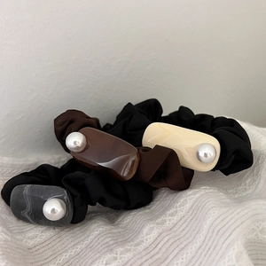 Three-piece set of silk-texture scrunchies with acrylic pieces and pearls in earth tones