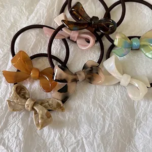 Set of 6 French style acetate bow hair ties with tortoiseshell and marble patterns