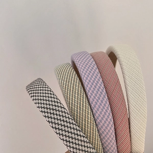 Close-up of assorted vintage fabric headbands with elegant textures and patterns