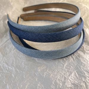 Detailed close-up showing three shades of denim headbands with non-slip brown lining