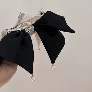 Elegant bow hair clip with contrast satin and pearl tassels for a sophisticated look