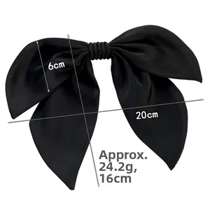 Detail showing 20cm x 16cm dimensions of a large black satin French bow hair clip