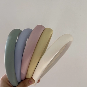 Detailed set of five padded macaron-colored headbands made of soft fabric sponge