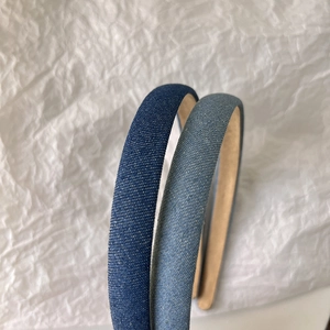 Detail of blue denim headbands with textured fabric finish and anti-slip lining