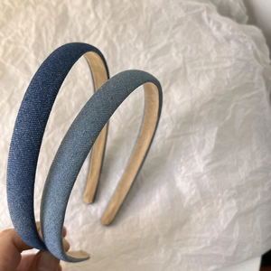 Detailed texture of blue denim headbands with soft non-slip faux leather lining