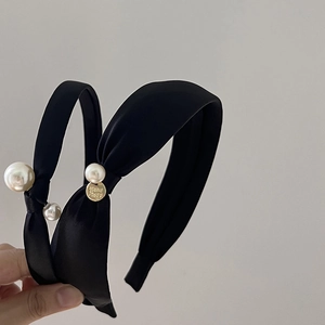 Elegant black satin knotted headbands with pearl accents and gold handmade pendant
