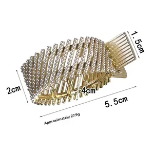 Detailed view of luxury gold hair claw clip with pearls measuring 5.5cm in length