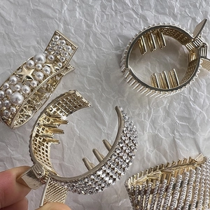 Luxurious gold hair claw clip set with rhinestones and pearls for elegant updos