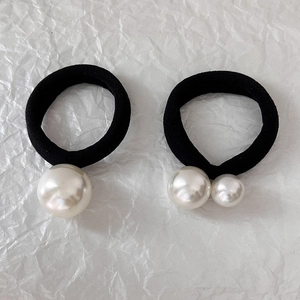 Elastic black hair ties set with glossy faux pearls for minimalist hairstyles