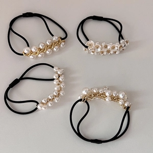 French pearl hair ties set with black elastic bands and golden chain details