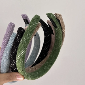 Detail shot of vintage lattice texture sponge headbands with various color options