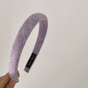 Detail of lavender tweed braided headband with Hand Made label on inner side