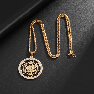 Gold Metatron's Cube pendant necklace with crystal border and intricate geometric cutout