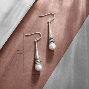Vintage copper crown pearl drop earrings measuring five centimeters in total length