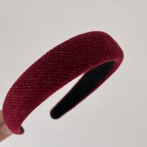 Detailed view of the deep red burgundy velvet headband with 3D twill textured fabric
