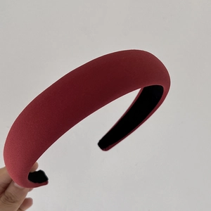Detail of burgundy velvet padded headband with black non-slip inner lining for women