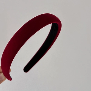 Detailed close-up of premium burgundy velvet padded headband with non-slip black lining
