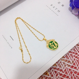 Gold dragon pendant necklace with green inlay and Fu character charm for luck