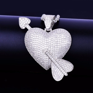 Hip hop cupid heart pendant necklace with shimmering crystals on a jewelry display