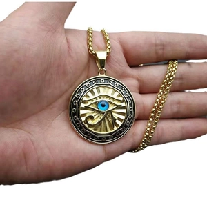 Gold Eye of Horus circular pendant necklace with blue eye inlay and round box chain