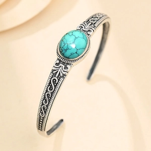 Vintage silver cuff bangle with turquoise stone and bohemian floral engraving pattern