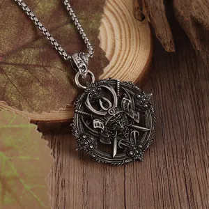 Detailed macro view of vintage gothic demon warrior pendant on a rustic wood surface